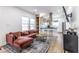 Modern living room featuring an open floor plan, wood flooring, and bright, airy space at 1466 Venetian Sw Dr, Atlanta, GA 30311