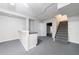 Spacious basement with kitchenette area, stairs to upper level, and neutral finishes at 3044 Windfield Cir, Tucker, GA 30084
