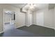 Finished basement with doorways to other rooms and durable gray carpeting at 3044 Windfield Cir, Tucker, GA 30084