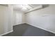 Finished basement room with gray carpet and a ceiling fan at 3044 Windfield Cir, Tucker, GA 30084