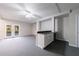 Open basement area with a bar/kitchenette, lots of light and neutral walls and carpeting at 3044 Windfield Cir, Tucker, GA 30084