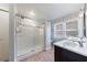 Bathroom with a spacious glass shower, tiled walls, and a window for natural light at 3044 Windfield Cir, Tucker, GA 30084