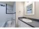 Bright bathroom with tile floors, a sink vanity, and a shower tub with a black and white accent at 3044 Windfield Cir, Tucker, GA 30084