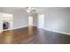 Large bedroom with hardwood floors and an adjacent laundry area at 3044 Windfield Cir, Tucker, GA 30084