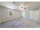 Spacious, bright bedroom with neutral walls, carpet, and a ceiling fan at 3044 Windfield Cir, Tucker, GA 30084