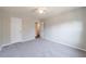 This bedroom features neutral decor and an ensuite door at 3044 Windfield Cir, Tucker, GA 30084