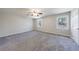 Expansive bedroom with neutral carpet, two windows, and ample space at 3044 Windfield Cir, Tucker, GA 30084