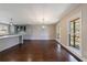 Dining area with hardwood floors, windows overlooking the backyard, and modern lighting fixtures at 3044 Windfield Cir, Tucker, GA 30084