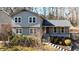 Charming two-story home with a gray facade, complemented by a well-manicured front yard at 3044 Windfield Cir, Tucker, GA 30084