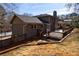 This home's exterior features a spacious deck and neutral paint, with views of the private backyard at 3044 Windfield Cir, Tucker, GA 30084