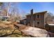 Back exterior of the home with a deck and treehouse featuring neutral paint and a partially fenced yard at 3044 Windfield Cir, Tucker, GA 30084