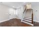 Inviting foyer features hardwood floors, a staircase, and a view of the front entry at 3044 Windfield Cir, Tucker, GA 30084
