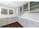 Kitchen with gray cabinets, white countertops, and stainless steel appliances at 3044 Windfield Cir, Tucker, GA 30084