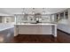Spacious kitchen with stainless steel appliances, a large island with cooktop, and gray cabinetry at 3044 Windfield Cir, Tucker, GA 30084