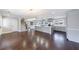 Spacious kitchen with stainless steel appliances, gray cabinets, island, hardwood floors, and modern lighting at 3044 Windfield Cir, Tucker, GA 30084