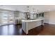Modern kitchen with stainless steel appliances, a center island, and access to the outdoor deck at 3044 Windfield Cir, Tucker, GA 30084