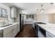 Modern kitchen featuring stainless steel appliances, gray cabinets, and a large kitchen island at 3044 Windfield Cir, Tucker, GA 30084