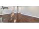 Hardwood floors and white trim in living area adjacent to kitchen at 3044 Windfield Cir, Tucker, GA 30084