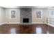 Bright living room showcasing a fireplace, hardwood floors, and natural light at 3044 Windfield Cir, Tucker, GA 30084