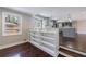Open-concept living room with built-in shelving and hardwood floors at 3044 Windfield Cir, Tucker, GA 30084