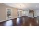 Living room with hardwood floors, large windows, and staircase at 3044 Windfield Cir, Tucker, GA 30084