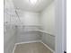 Walk-in closet features adjustable shelving to maximize storage space at 3044 Windfield Cir, Tucker, GA 30084