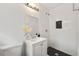 Bathroom featuring a glass shower with white subway tile and a black honeycomb tile floor at 3648 Garrison Sw Dr, Atlanta, GA 30331