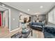 Open living space with modern grey paint and a view of the breakfast bar and dining area at 3648 Garrison Sw Dr, Atlanta, GA 30331