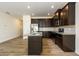 Modern kitchen with stainless steel appliances, granite countertops, and dark cabinetry at 4940 Elm Brook Dr, Atlanta, GA 30349