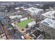 Captured from above, a bustling city street unfolds with a mix of commercial establishments and a vibrant town square at 145 Rose Garden Ln, Alpharetta, GA 30009