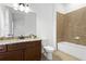 Bathroom featuring granite countertops, a single sink, and a shower-tub combination at 145 Rose Garden Ln, Alpharetta, GA 30009