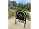 Bike rack with Alpha Loop logo, trees in the background at 145 Rose Garden Ln, Alpharetta, GA 30009