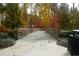 Picturesque bridge surrounded by colorful foliage in a serene community park setting at 145 Rose Garden Ln, Alpharetta, GA 30009