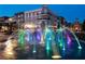 Beautiful community fountain with colorful lights and nearby buildings at 145 Rose Garden Ln, Alpharetta, GA 30009