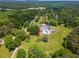 Lush estate with stunning pool, manicured lawns, mature trees, and inviting outdoor spaces at 2595 Ross Rd, Snellville, GA 30039
