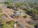 Aerial view of an estate featuring a home, pool, and large yard with mature trees at 2595 Ross Rd, Snellville, GA 30039