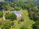 Expansive property featuring a gorgeous pool, mature trees, and lush green lawn at 2595 Ross Rd, Snellville, GA 30039