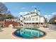 Backyard boasts a sparkling in-ground pool, perfect for relaxation and recreation at 2595 Ross Rd, Snellville, GA 30039