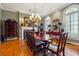 Formal dining room featuring hardwood floors and elegant chandelier at 2595 Ross Rd, Snellville, GA 30039