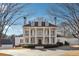 Stately colonial home with grand entrance featuring white columns and symmetrical design at 2595 Ross Rd, Snellville, GA 30039
