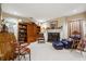 Cozy living room with a fireplace, built-in shelves, and comfortable seating for relaxation at 2595 Ross Rd, Snellville, GA 30039