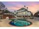Backyard with a pristine in-ground pool and lush landscaping; ideal for relaxation at 2595 Ross Rd, Snellville, GA 30039