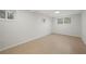 This basement features tile flooring, a window for natural light, and neutral wall paint at 6605 Black Bend Ct, Riverdale, GA 30274