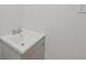 Corner sink and gray vanity against a bright white wall in the bathroom at 6605 Black Bend Ct, Riverdale, GA 30274