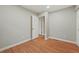 This bedroom features hardwood floors, and neutral wall paint at 6605 Black Bend Ct, Riverdale, GA 30274