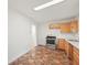 Kitchen featuring wooden cabinets, granite countertops, and stainless steel appliances at 6605 Black Bend Ct, Riverdale, GA 30274