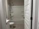 Bathroom features a shower and tub combo at 738 Basswood Ave, Mcdonough, GA 30252