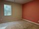 Comfortable bedroom with a large window and neutral carpeting at 738 Basswood Ave, Mcdonough, GA 30252