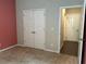 Bedroom with carpeting and double door closet at 738 Basswood Ave, Mcdonough, GA 30252