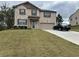 Charming two-story home featuring brick facade, and a well-manicured lawn at 738 Basswood Ave, Mcdonough, GA 30252